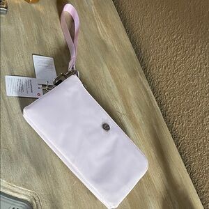 Lululemon Curved Wristlet 
Color is lavender 
NEW unused tags attached